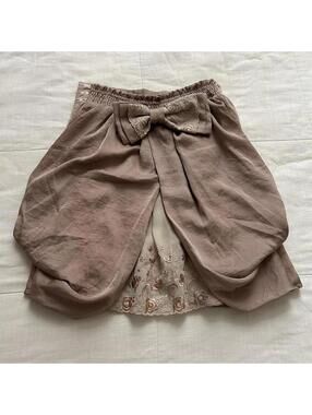 Axes Femme tan mauve pink satin skirt removable bow detail and floral embroidery